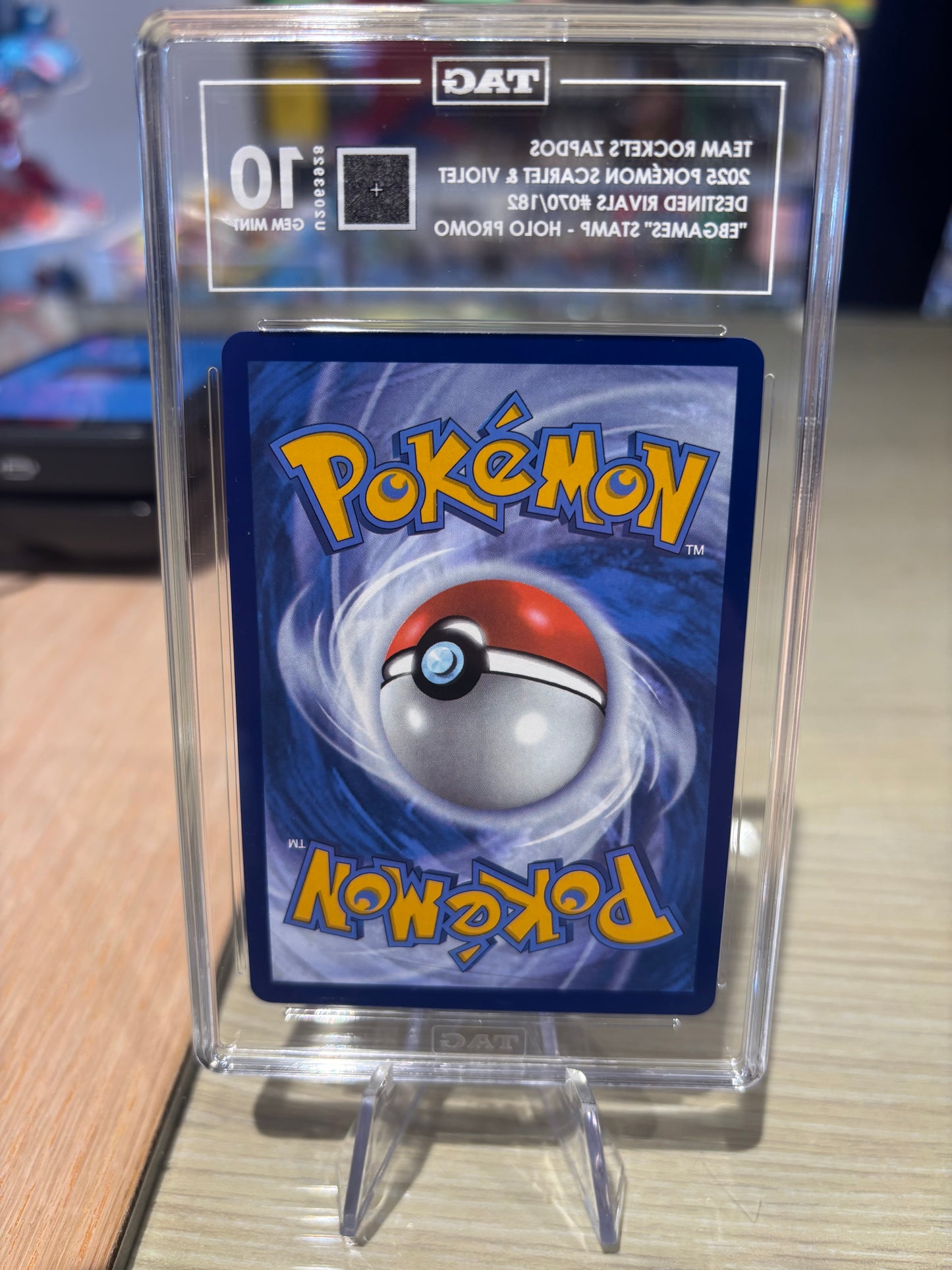 TAG 10 - Team Rocket’s Zapdos - 070/182 - EB Games Stamp