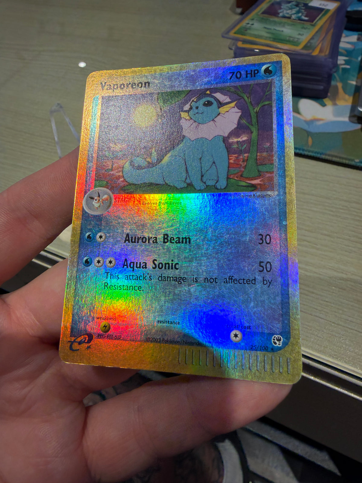 Vaporeon Reverse Holo - 25/100 - Sandstorm