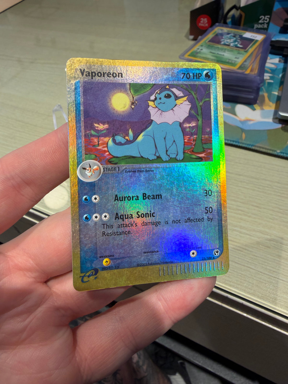 Vaporeon Reverse Holo - 25/100 - Sandstorm